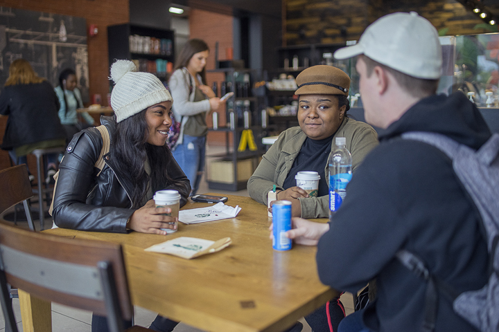 Brea Marshall, Houston senior, left, Melissa Dufort, Houston senior, middle, Joshua Thomas, Friendswood senior, right, enjoy coffee during the cold weather in Starbucks, Gray Library, yesterday. UP photo by Noah Dawlearn